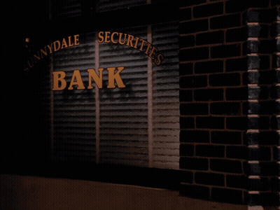 Woman Holding Bag In Front Of Innydale Securities Bank GIF