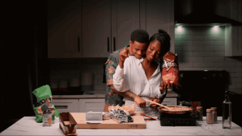 Woman Holding Bag Of Doritos GIF