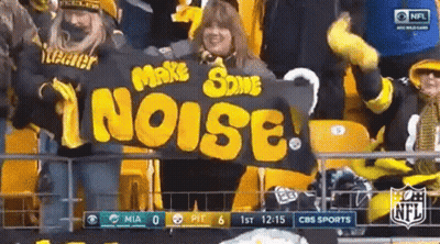 Woman Holding Banner Saying Make Some Noise GIF