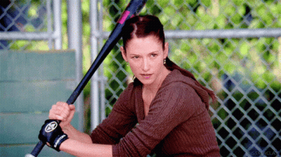 Woman Holding Baseball Bat With Easton Glove GIF