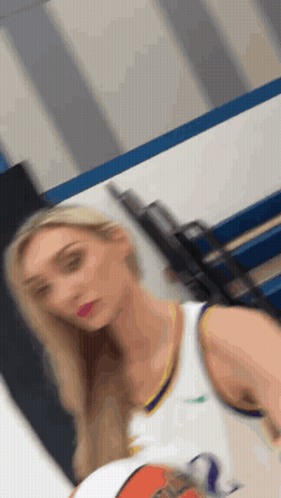 Woman Holding Basketball In Gym GIF