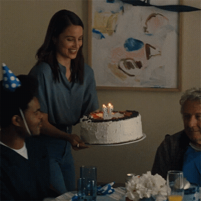Woman Holding Birthday Cake With Number 8 GIF