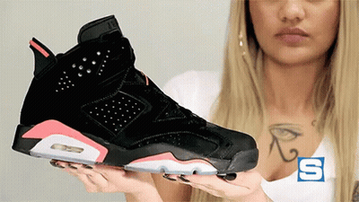 Woman Holding Black And Pink Shoes GIF