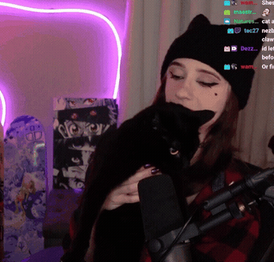 Woman Holding Black Cat Near Microphone Purple Heart GIF
