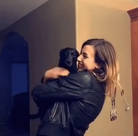 Woman Holding Black Dog GIF