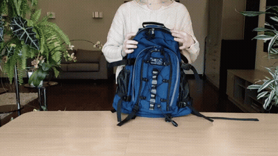 Woman Holding Blue Abercrombie & Fitch Backpack GIF