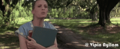Woman Holding Book In Park GIF