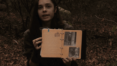 Woman Holding Book That Says That's Right GIF