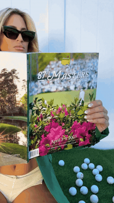 Woman Holding Book Titled 87 Masters GIF