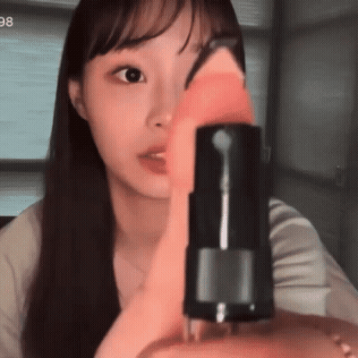 Woman Holding Bottle With 98 GIF