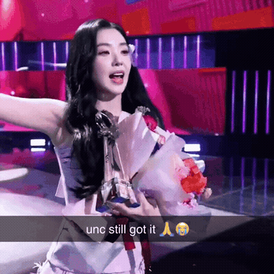 Woman Holding Bouquet And Trophy Unc Still Got It GIF