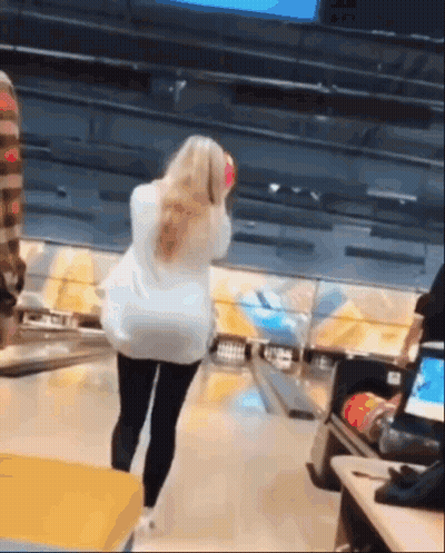 Woman Holding Bowling Ball On Bowling Alley GIF