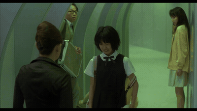 Woman Holding Briefcase Talks to Girl in Black Dress
