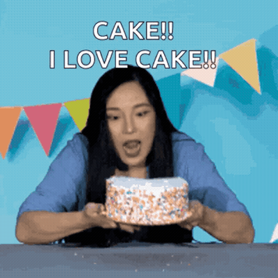Woman Holding Cake That Says I Love Cake GIF