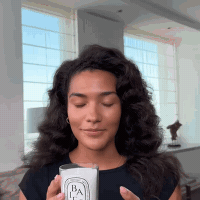 Woman Holding Candle With Letter B GIF