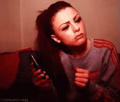 Woman Holding Cell Phone Saying Chorbearswagg GIF