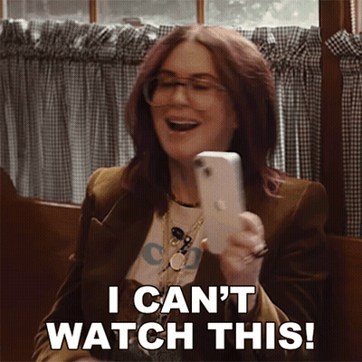 Woman Holding Cell Phone Saying I Can't Watch This GIF