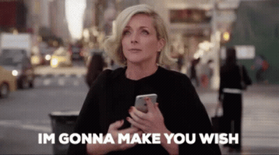 Woman Holding Cell Phone Saying I'm Gonna Make You Wish GIF