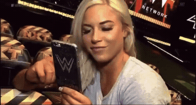 Woman Holding Cell Phone With W Logo GIF