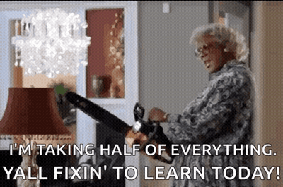Woman Holding Chainsaw In Front Of Lamp GIF