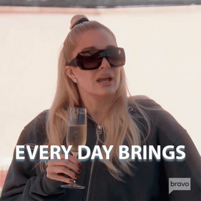 Woman Holding Champagne Saying Every Day Brings GIF