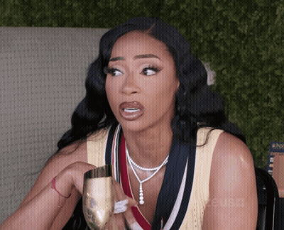 Woman Holding Champagne With Reuse Sign GIF