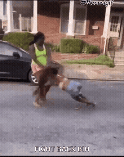 Woman Holding Child On Ground With Car Behind GIF