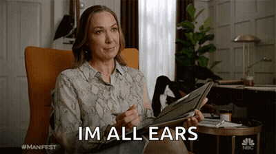 Woman Holding Clipboard Saying I'm All Ears GIF