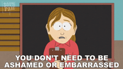 Woman Holding Clipboard Saying You Don't Need to Be Ashamed or Embarrassed