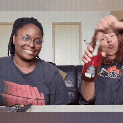Woman Holding Coca Cola Beside A Shirt Woman GIF