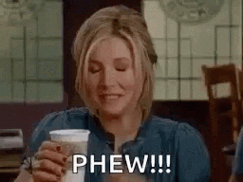 Woman Holding Coffee And Smiling GIF