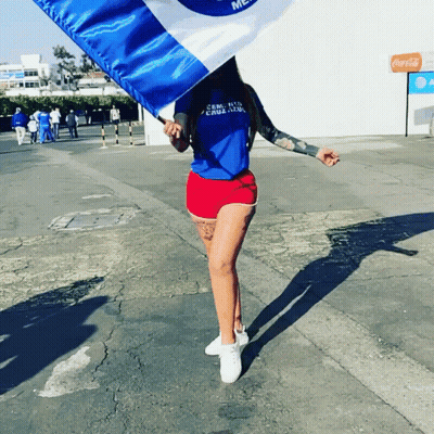 Woman Holding Cruzado Flag GIF