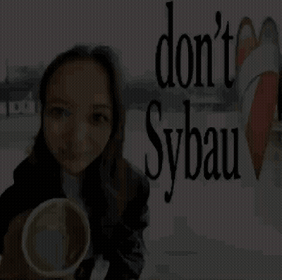 Woman Holding Cup By Sign Do N't Sybau GIF