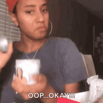 Woman Holding Cup Saying Okay GIF