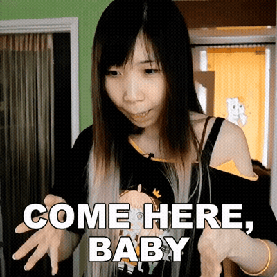 Woman Holding Doll Saying Come Here Baby GIF
