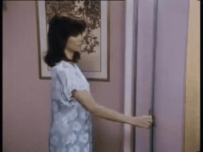 Woman Holding Door Open GIF