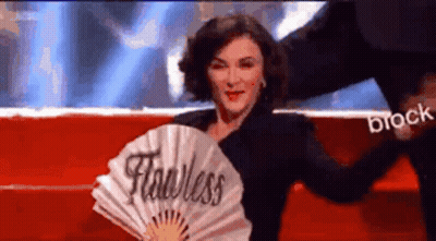 Woman Holding Fan Saying Fearless GIF