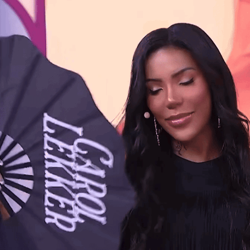 Woman Holding Fan That Says Carol Lekker GIF