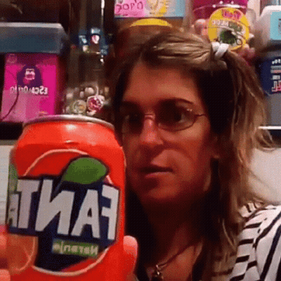 Woman Holding Fanta Can In Front Of Face GIF