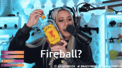Woman Holding Fireball Bottle And Talking GIF