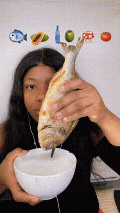 Woman Holding Fish And Bowl Of Food GIF