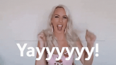 Woman Holding Fist And Saying Yay GIF