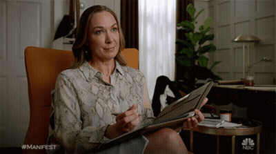 Woman Holding Folder With NBC Logo GIF