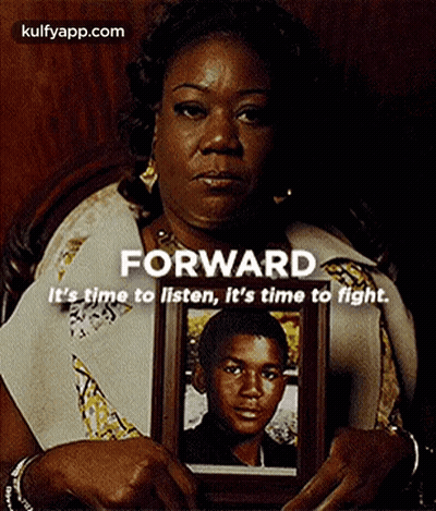 Woman Holding Framed Picture Of Young Boy GIF
