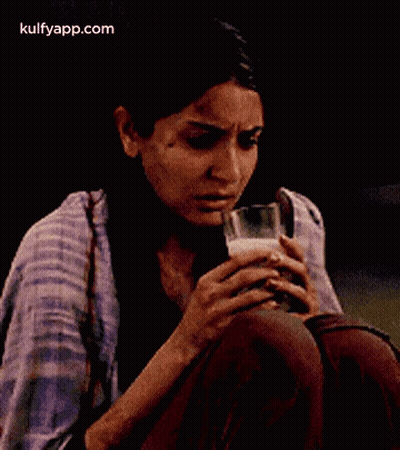Woman Holding Glass Of Milk GIF