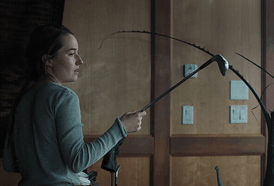 Woman Holding Golf Club In Front Of Thermostat Saying A GIF