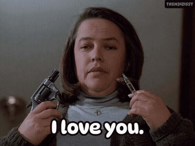 Woman Holding Gun And Syringe Saying I Love You GIF