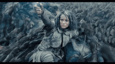 Woman Holding Gun In Front Of Crowd GIF
