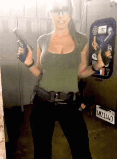 Woman Holding Gun In Front Of License Plate LMZ1L40 GIF