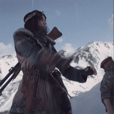 Woman Holding Gun In Front Of Mountain GIF